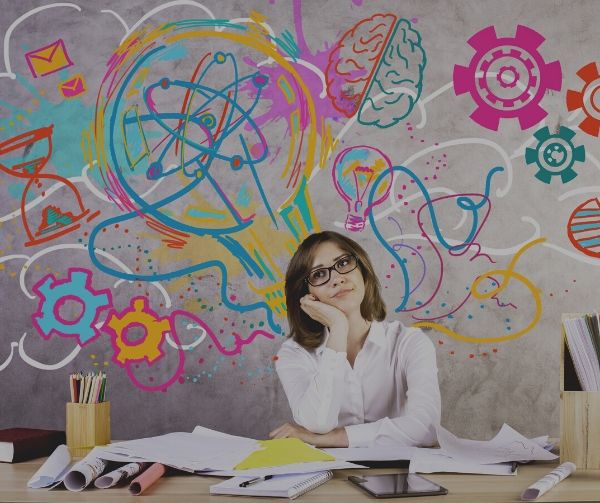 woman thinking with gears lightbulbs brains and molecules floating above her head